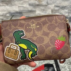 Sale! This week only! Coach Brown Wristlet with Black Dice and Heart